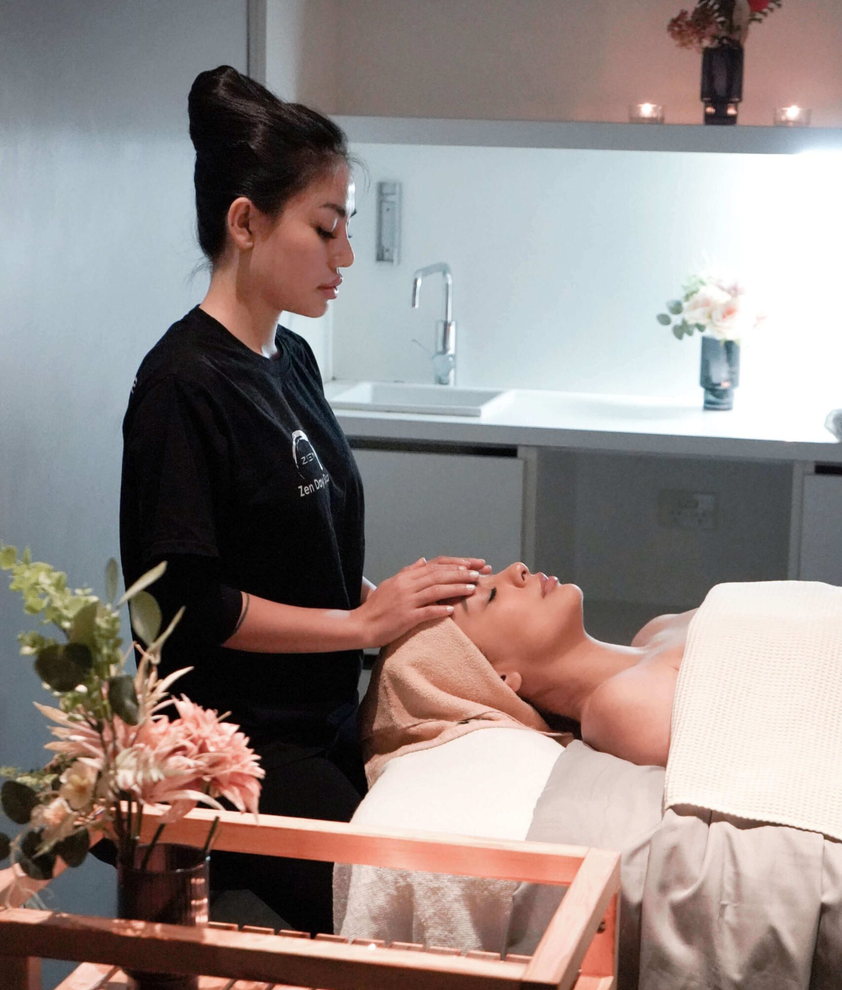 Zen Day Spa therapist performing a relaxing facial treatment